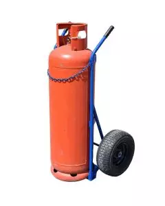 Gas cylinder trolley with sturdy blue frame and large pneumatic wheels, designed for transporting heavy red gas bottles safely in industrial environments.